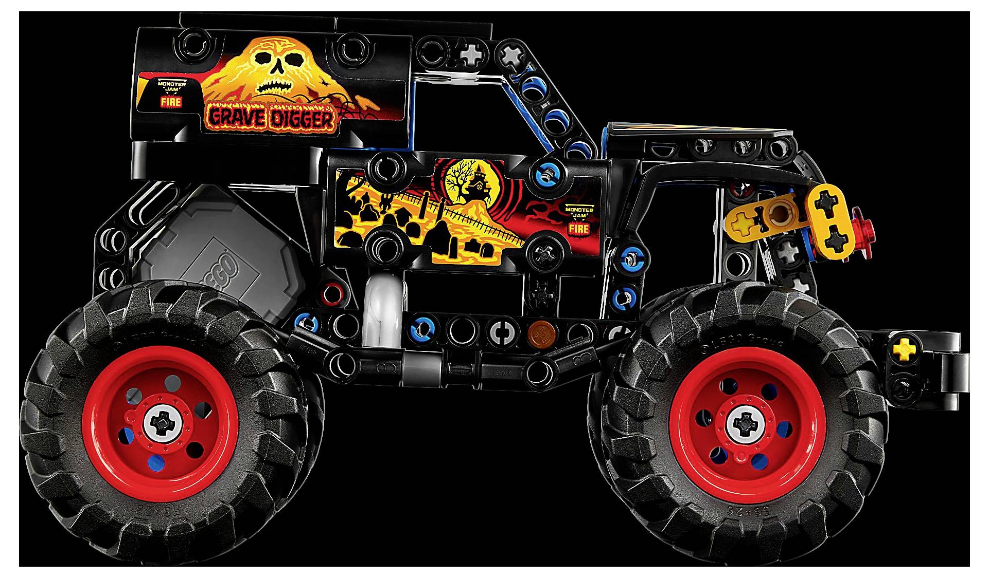 Ein schwarzer und roter Spielzeug-Monstertruck aus Bausteinen, ausgestattet mit einem 'Grave Digger' Design mit Flammen- und Schädel-Grafiken an der Seite.