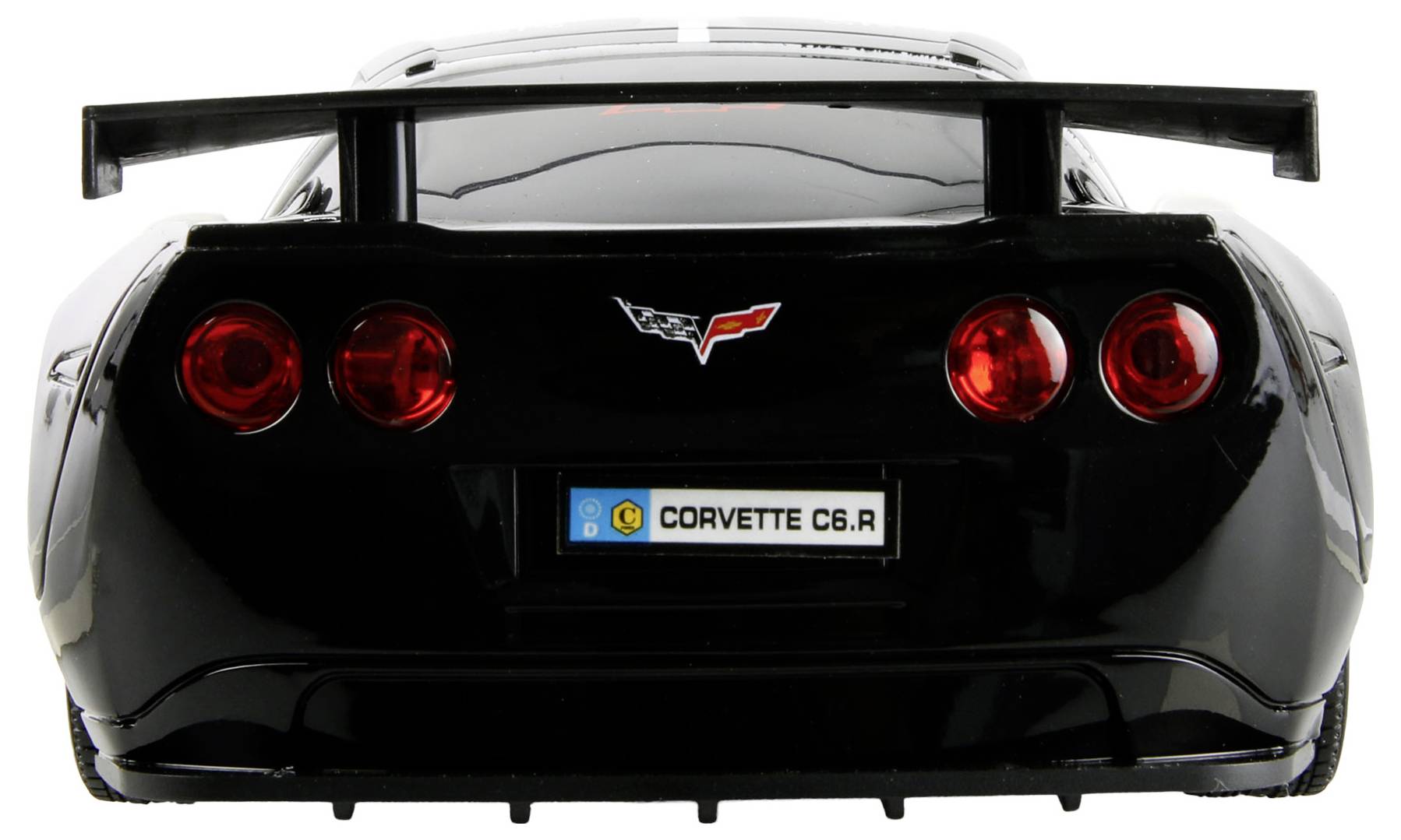 Das Bild zeigt die Rückansicht eines schwarzen Corvette C6.R Modellautos mit roten Rücklichtern und einem auffälligen Nummernschild, auf dem 