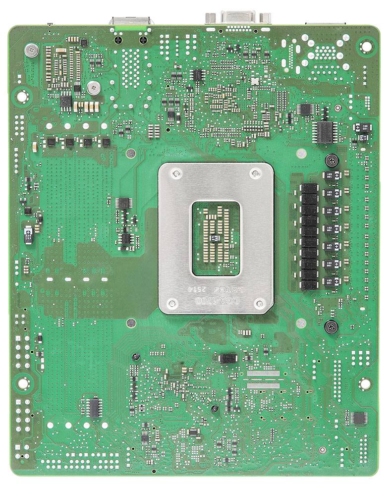 Eine grüne Mainboard mit verschiedenen Schaltkreiskomponenten, darunter eine zentrale metallische Struktur, Mikrochips, Widerstände und Kondensatoren.