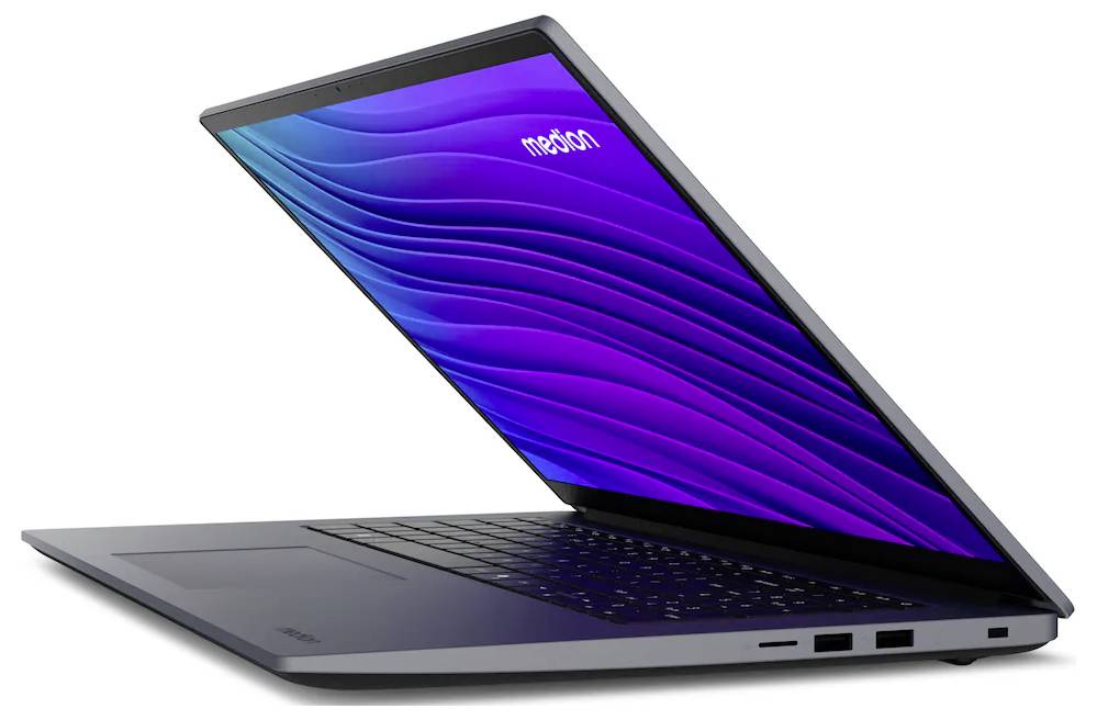 Ein teilweise geöffneter Laptop, der einen leuchtenden Bildschirm mit einer gewellten violetten Grafik und dem Wort 