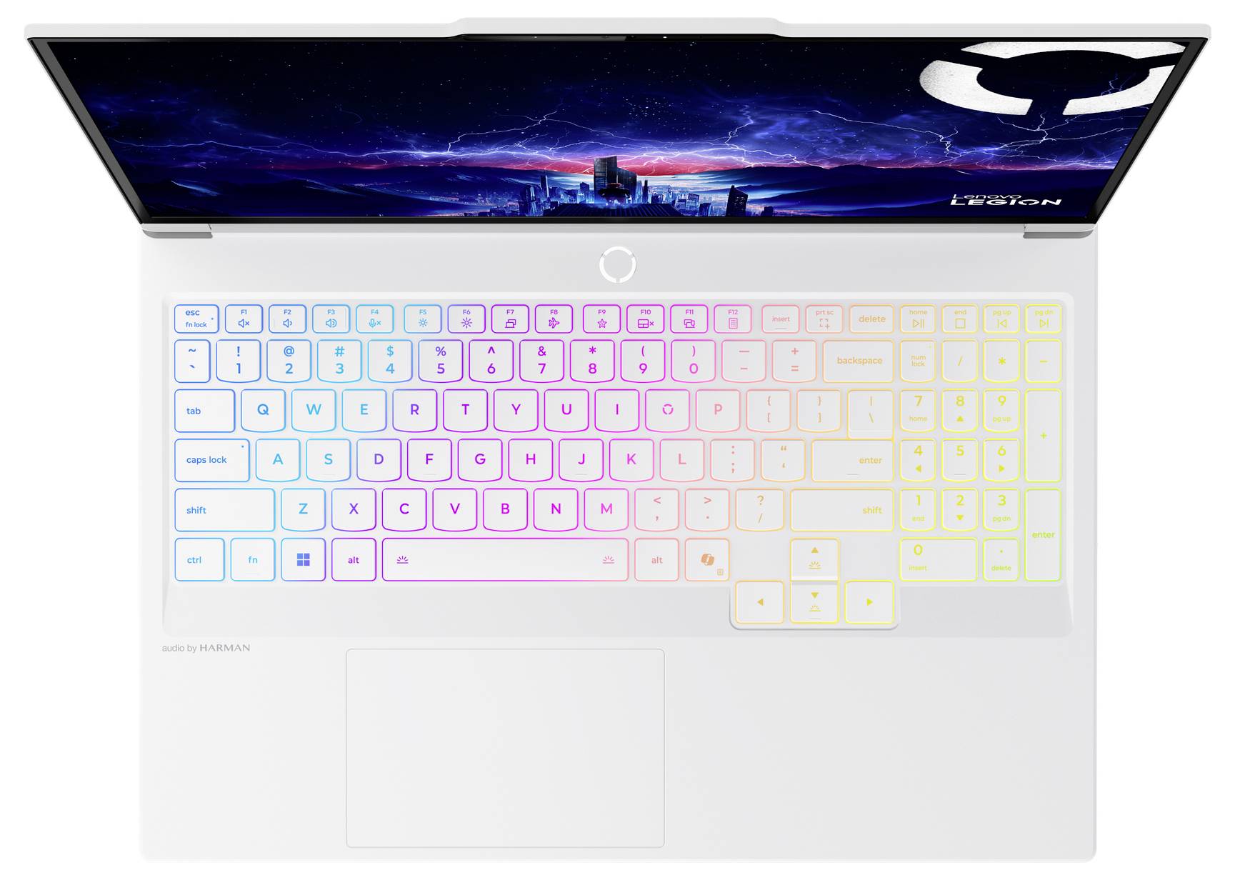 Ein weißer Laptop mit einer bunten beleuchteten Tastatur und einer Stadtlandschaft auf dem Bildschirm, von oben betrachtet.