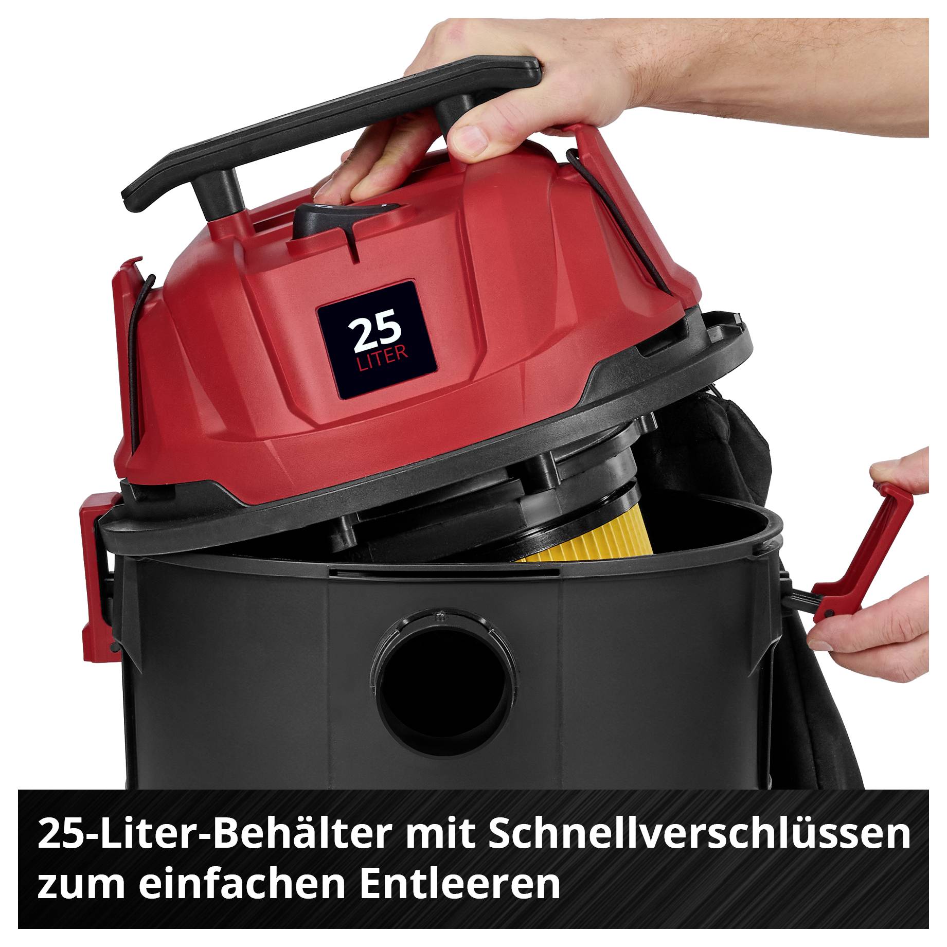 Ein roter Industriestaubsauger mit einem 25-Liter-Behälter und Schnellverschlüssen für einfaches Entleeren. Person bedient den Hebel.