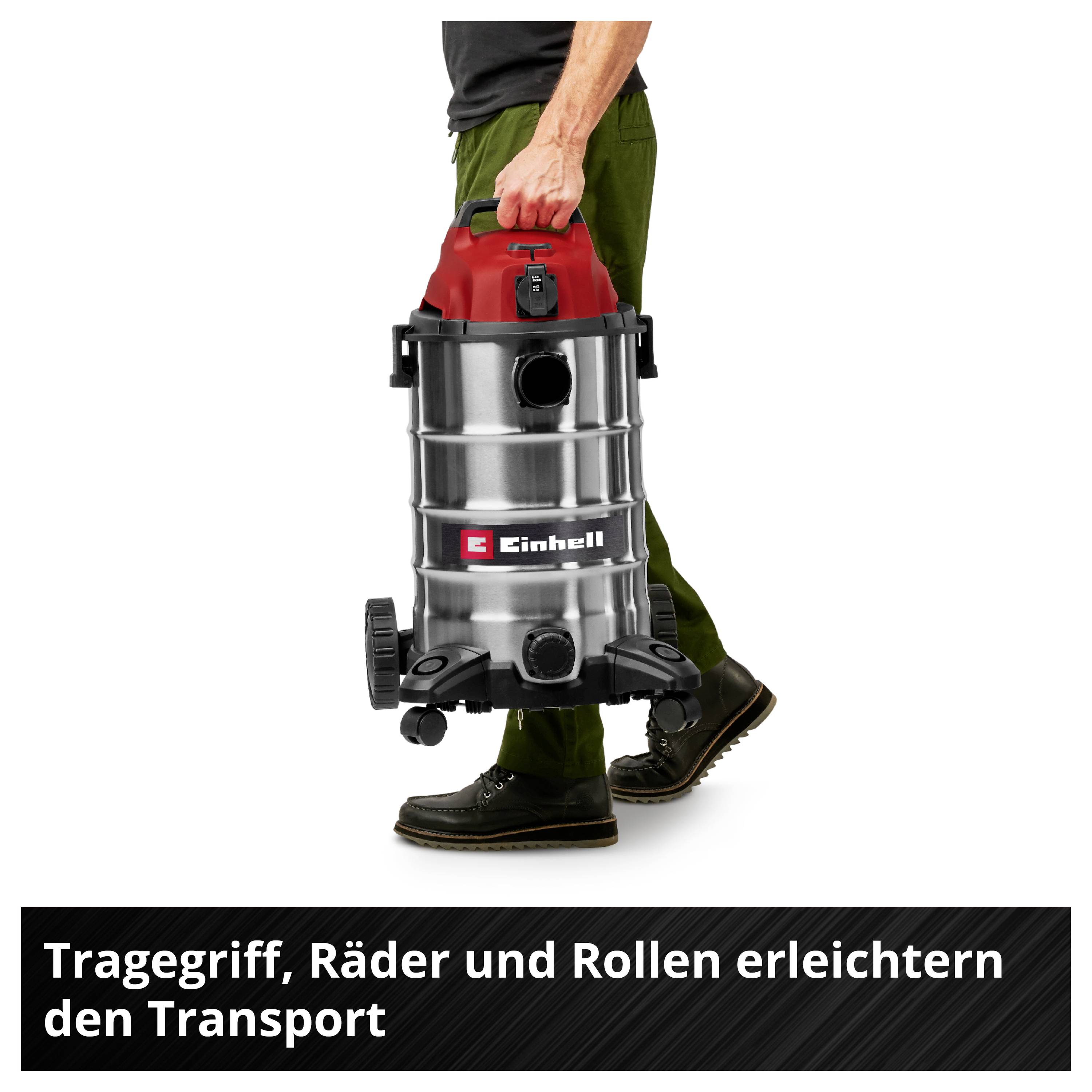 Person trägt einen Industriestaubsauger mit Griff, Rädern und Rollen für einfachen Transport. Text im Bild: 'Tragegriff, Räder und Rollen erleichtern den Transport'.