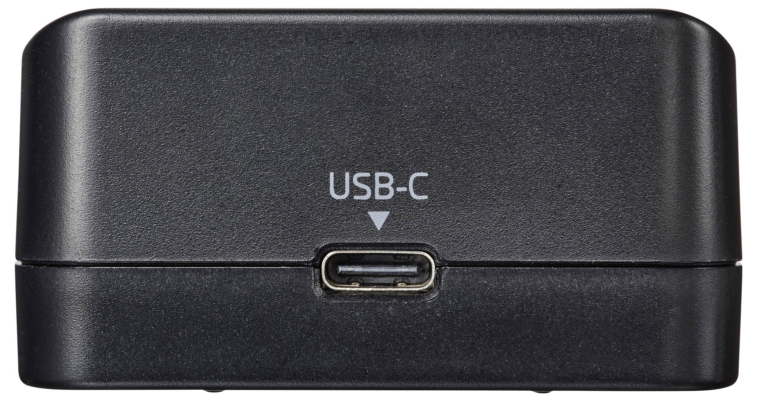 Ein schwarzes Ladedock mit einem sichtbaren USB-C-Anschluss, der mit „USB-C