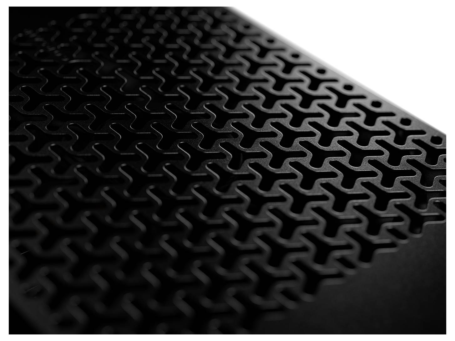 Geometrisches Muster aus verschachtelten Formen auf einer dunklen Oberfläche, das eine strukturierte, dreidimensionale Erscheinung erzeugt.