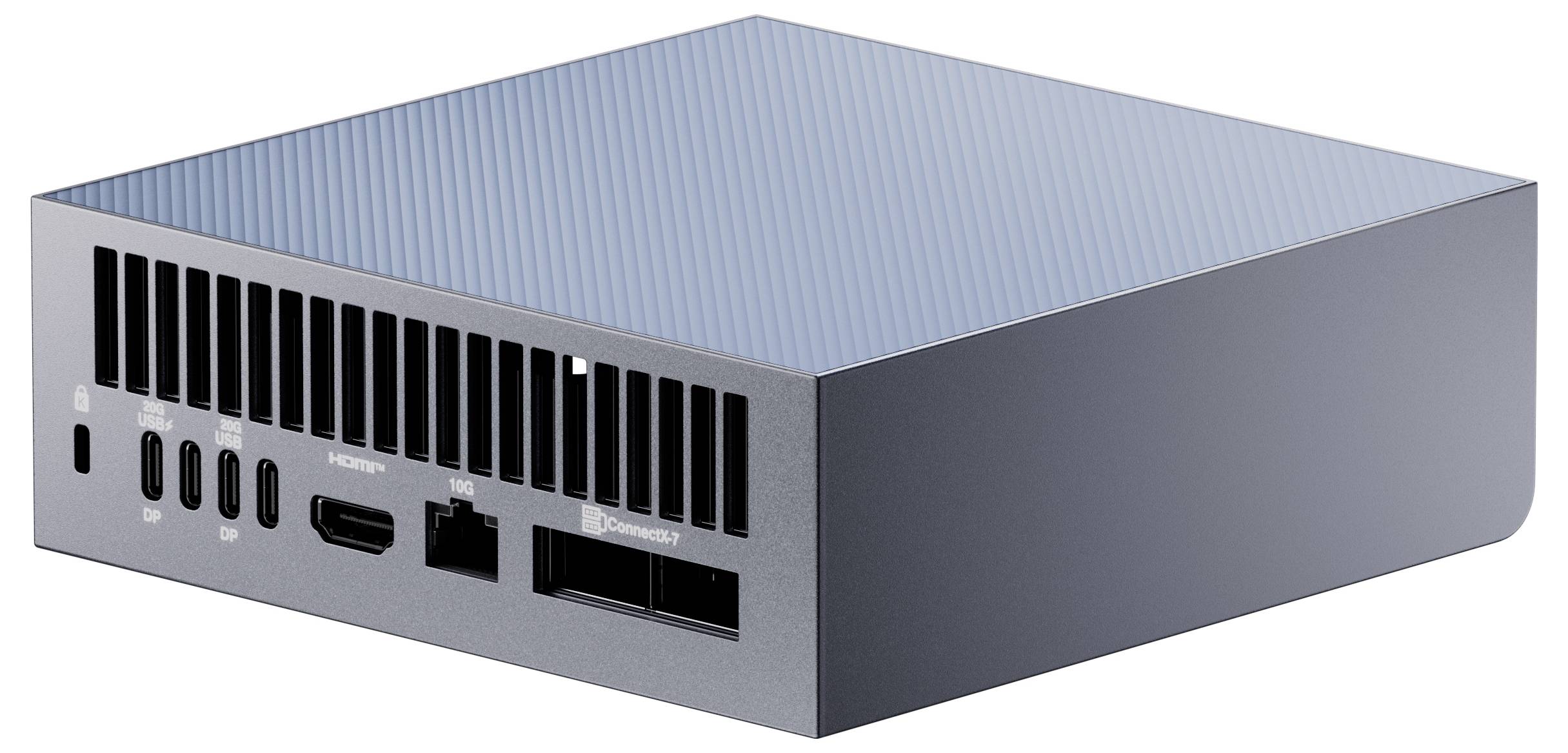 Ein kompakter, schlanker Computer mit mehreren Anschlüssen an seiner Seite, darunter USB-C, HDMI und Ethernet, der auf einer ebenen Oberfläche ruht.