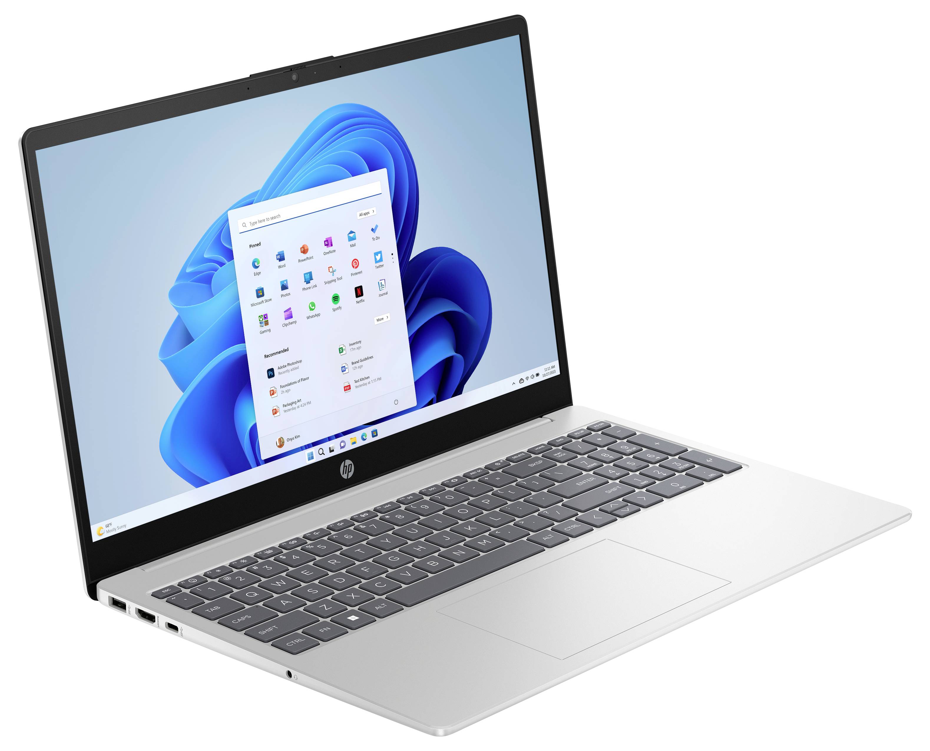 Ein silberner Laptop, der einen Startbildschirm mit Symbolen und Windows-Benutzeroberfläche zeigt, vor einem hellen Hintergrund.