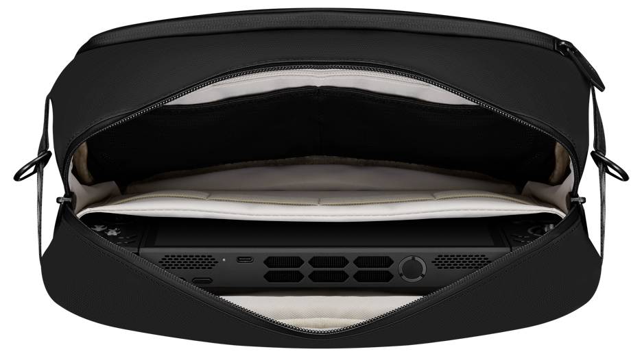 Geöffnete schwarze Tasche mit einem Spielgerät, dessen Lüftungsschlitze und Tasten sichtbar sind, ordentlich in einem Schutzfach platziert.
