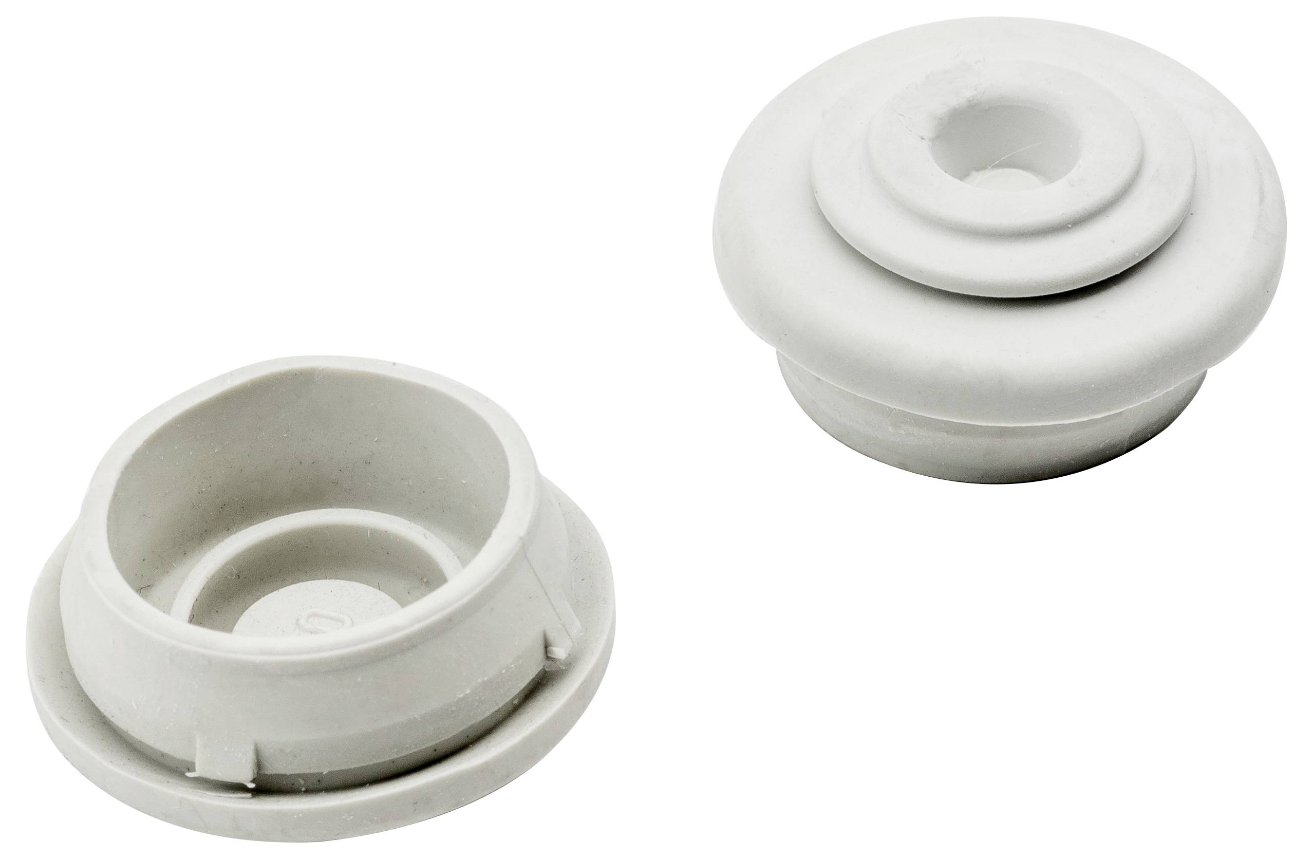 Zwei weiße Gummiringe, einer liegt auf seiner Seite und der andere steht aufrecht, zeigt verschiedene Perspektiven.