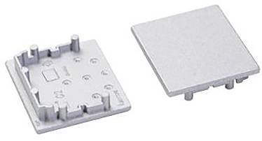 Zwei metallische rechteckige Platten, eine mit erhöhten Komponenten und Ausrichtungsstiften, wahrscheinlich für die elektronische Montage oder das Gehäuse verwendet.