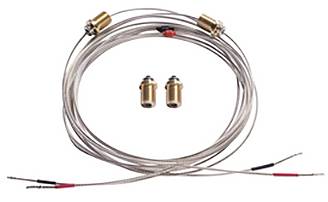 Eine aufgerollte Länge aus Metalldraht mit vier kleinen goldfarbenenen Anschlüssen und zwei abnehmbaren Komponenten in der Mitte angebracht.