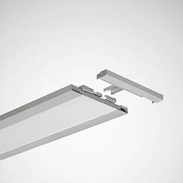 Eine Illustration einer linearen LED-Leuchte mit einem Abschnitt, der ihr modulares Steckverbinderstück separat vom Hauptgerät zeigt, vor einem neutralen Hintergrund.