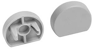 Zwei graue Kunststoff-Halbkreis-Endkappen mit internen Nuten, wahrscheinlich zum Finishing von Kanten an Möbeln oder Beschlägen verwendet.