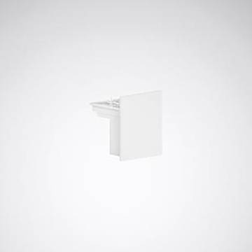 Ein weißes, minimalistisches, wandmontiertes Badezimmerbecken von der Seite gegen einen einfachen grauen Hintergrund betrachtet.