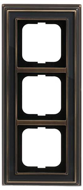 Ein dreifaches Schalter-Panelrahmen mit Bronze- und Schwarzakzenten, konzipiert für die Unterbringung von drei Schaltern oder Steckdosen, vertikal angeordnet dargestellt.