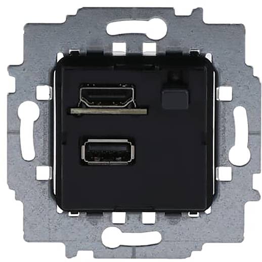 Eine Nahaufnahme einer wandmontierten USB- und HDMI-Steckdosenplatte mit Metallrahmen, geeignet für Anschlüsse elektronischer Geräte.