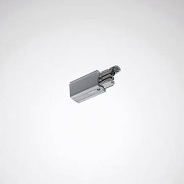 Ein kleines, rechteckiges elektronisches Gerät mit einem hervorstehenden Stecker, positioniert vor einem einfachen, hellen Hintergrund.