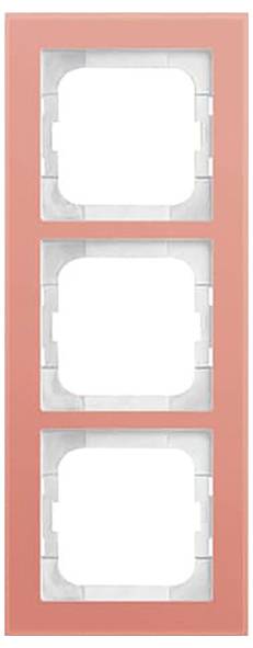 Ein korallenroter Rahmen mit drei quadratischen Öffnungen zum Halten von modularen Komponenten, wahrscheinlich für Schalter oder Steckdosen in der Wohnraumgestaltung verwendet.