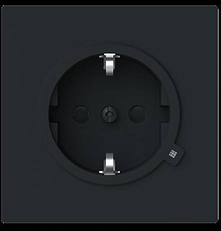 „Eine schwarze Steckdose mit zwei Stiften und einem kreisförmigen Design in der Mitte eines schwarzen Panels.