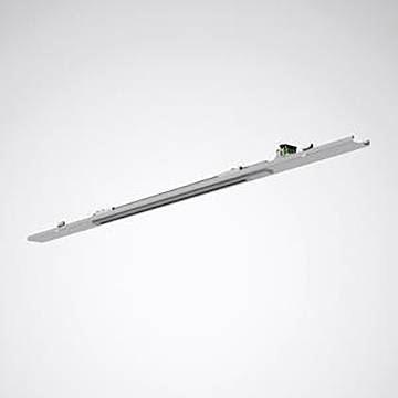 Eine lineare LED-Leuchte, dünn und elegant, mit einer metallischen grauen Oberfläche, vor einem einfachen grauen Hintergrund.