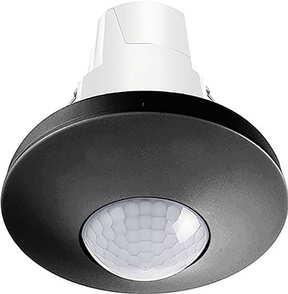Deckenmontierter Bewegungsmelder mit weißer Basis und schwarzer kreisförmiger Abdeckung, entwickelt zur Bewegungserkennung für Beleuchtungs- und Sicherheitszwecke.