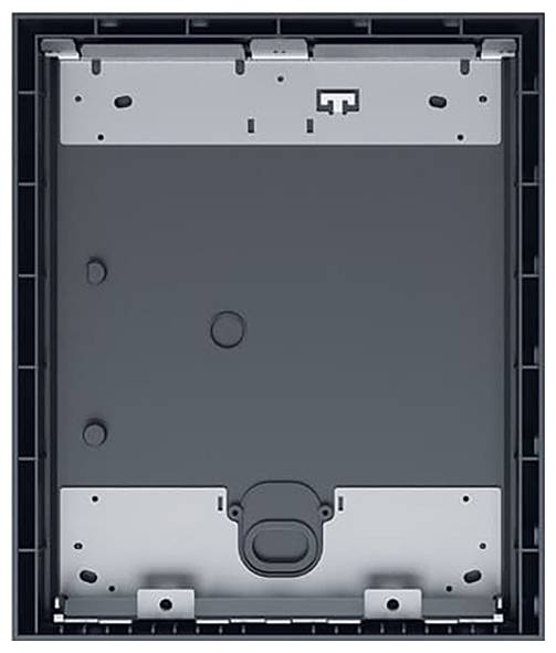Ein rechteckiges graues Metallpanel in einem dunklen Rahmen mit mehreren Löchern und zwei rigelartigen Elementen in der unteren Hälfte.