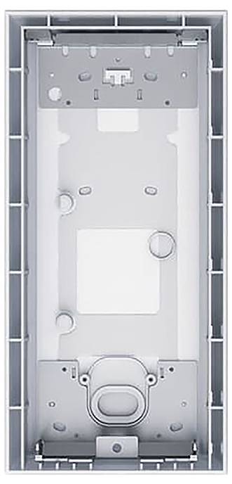 Ein rechteckiges, leeres elektronisches Gerätegejäuse mit Befestigungsklemmen und verschiedenen kreisförmigen Anschlussöffnungen für Kabel auf seiner Oberfläche.