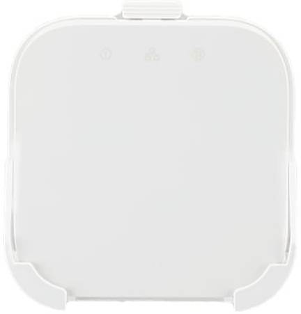 Ein einfaches, weißes, abgerundetes quadratisches Objekt mit subtilen Markierungen auf der Oberseite. Es sind keine sichtbaren Texte oder deutlichen Merkmale vorhanden.