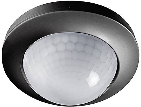 Deckenmontagebewegungsmelder mit weißer Kuppel und schwarzem Rand, verwendet zur Bewegungserkennung zur Steuerung von Beleuchtungs- oder Sicherheitssystemen.