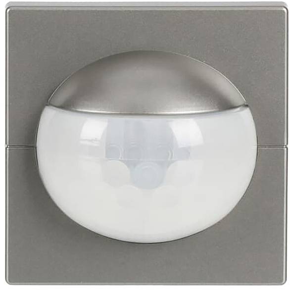 Ein quadratischer metallischer Bewegungsmelder mit gewölbter weißer Abdeckung, der zur Bewegungserkennung konzipiert ist.