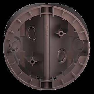 Ein braunes, kreisförmiges, flaches Objekt mit einem gerippten Muster, das mehrere kleine Löcher und Kerben aufweist, die gleichmäßig über die Oberfläche verteilt sind.