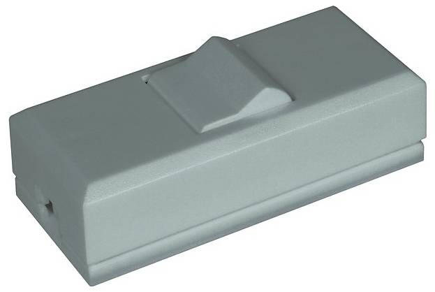 Ein grauer Kunststoff-Türstopper mit einer pyramidenförmigen Oberseite, der zum Offenhalten oder Schließen von Türen verwendet wird.