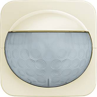 Ein rundes, eingelassenes Leuchtengehäuse mit einer blaugetönten Glasabdeckung, das ein kreisförmiges Muster und einen cremefarbigen Rahmen aufweist.