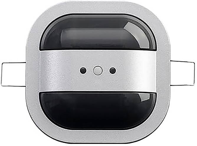 Draufsicht auf ein metallisches und schwarzes Gerät mit zwei seitlichen Vorsprüngen und drei kleinen kreisförmigen Elementen in der Mitte.