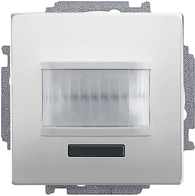 Ein an der Wand montierter Bewegungsmelder-Schalter mit silbernem Rahmen, mit einem zentralen Sensor und einem kleinen rechteckigen Display am unteren Ende.