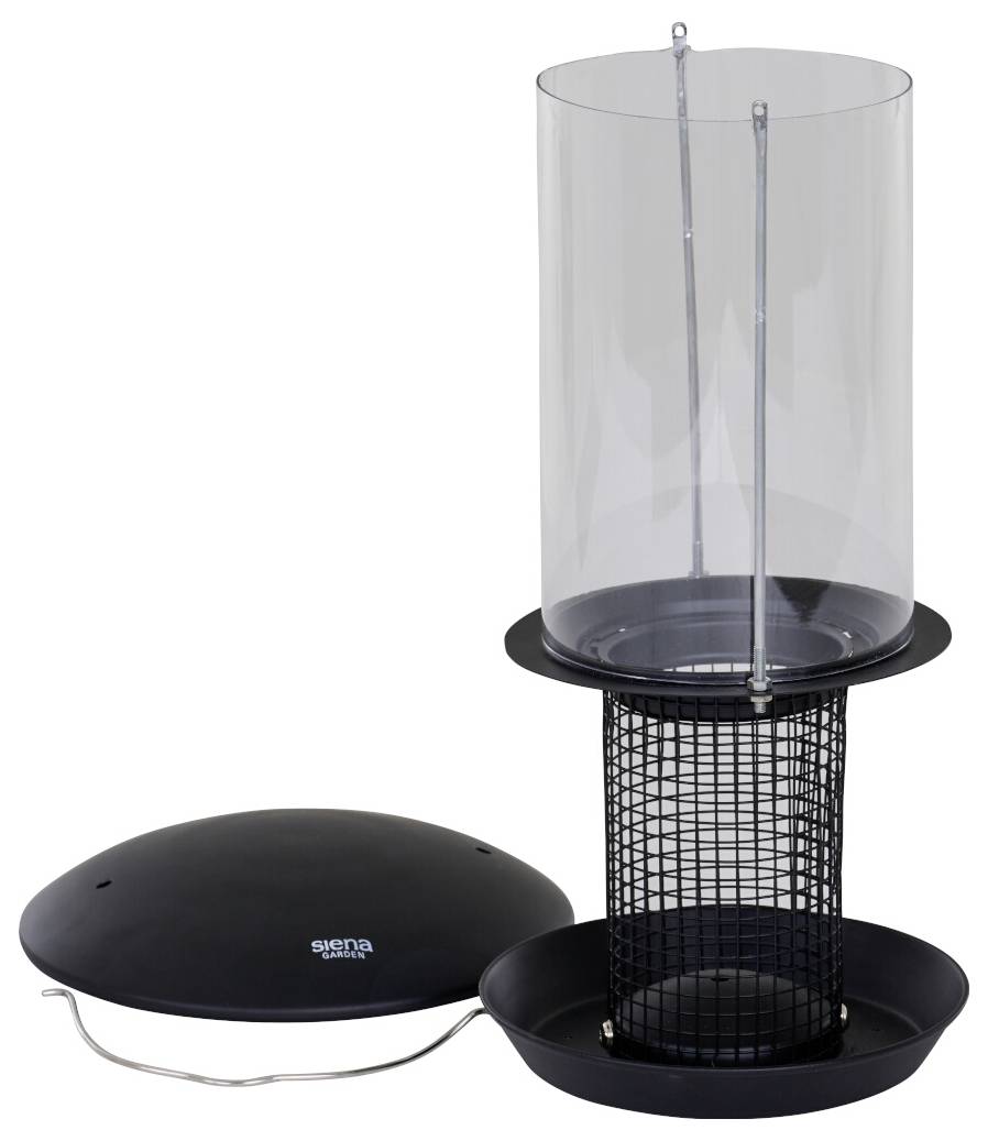 Vogelfutterspender mit zylindrischem, transparentem Kunststofftop und schwarzer Metallgitterunterlage für Samen, daneben auf dem Boden ein passendes schwarzes Deckel.