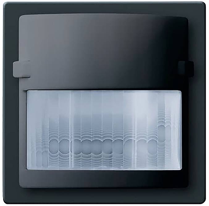 Ein schwarzer wandmontierter Bewegungsmelder mit gewölbter Linse für die Verwendung im Innenbereich, hauptsächlich zur Erkennung von Bewegungen für Sicherheits- oder Automatisierungszwecke.