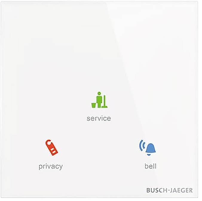 Ein weißes Wandpanel mit drei Symbolen: einem roten 