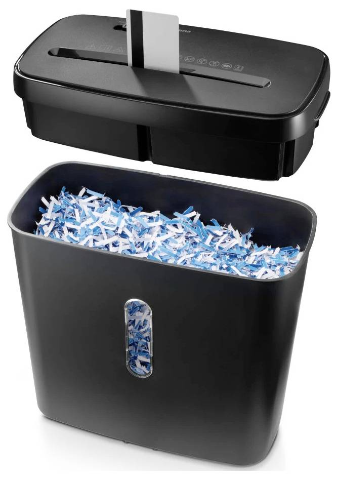 Ein Aktenvernichter, bei dem ein Dokument geschreddert wird und blaue und weiße Papierschnipsel im Auffangbehälter darunter sichtbar sind.