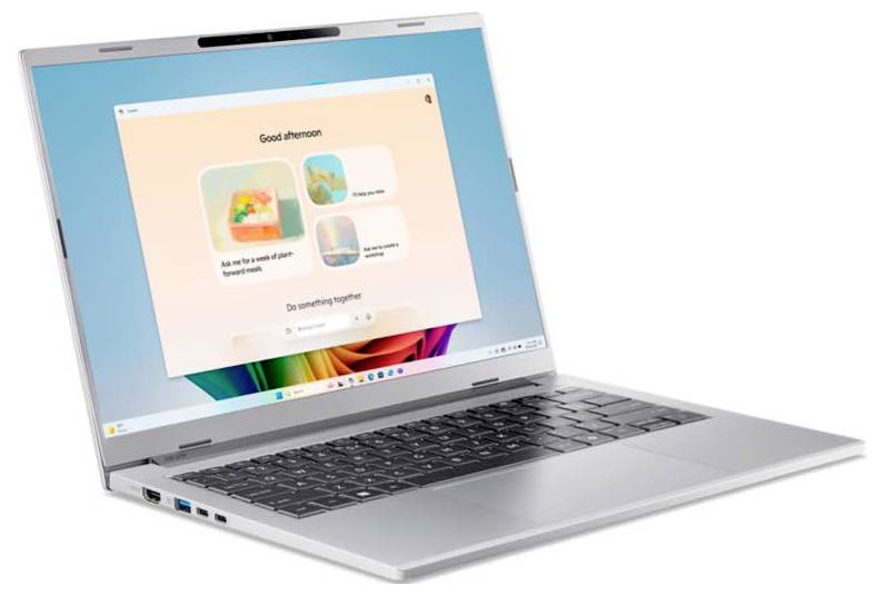 Ein silberner Laptop mit einem farbenfrohen Bildschirm, der ein übersichtliches Layout von Apps präsentiert und eine moderne Benutzeroberfläche zeigt.