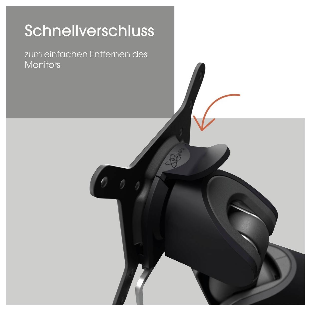 'Schnellverschluss' Mechanismus zum einfachen Entfernen eines Monitors, sichtbar mit einem Pfeil, der den Hebel zeigt. Hintergrund grau.