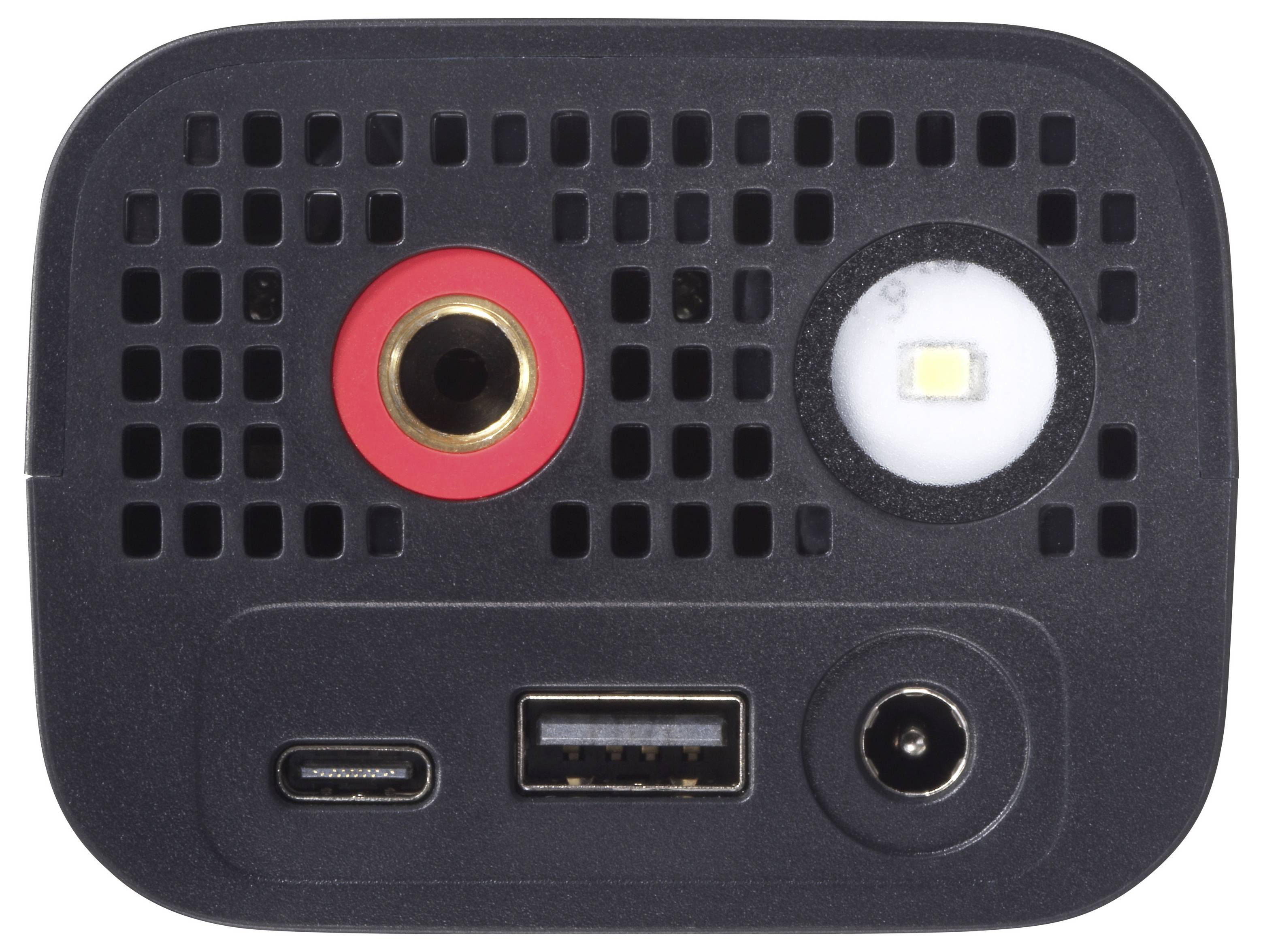 „Nahaufnahme eines elektronischen Geräts mit USB-C-Anschluss, USB-A-Anschluss, Netzteilbuchse und einem Sensor unter einer perforierten Oberfläche.
