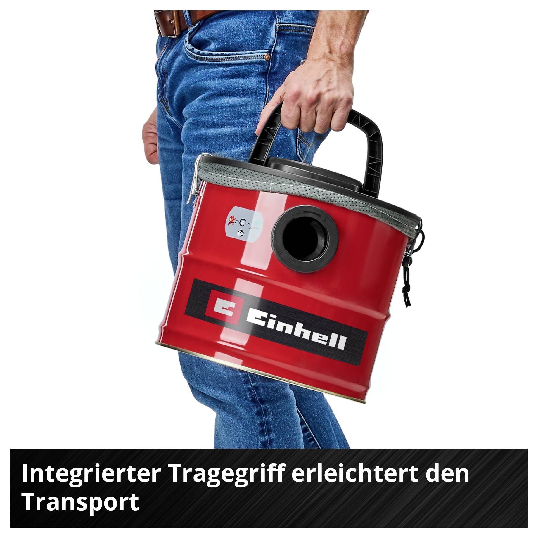Person trägt einen roten Einhell Staubsauger mit integriertem Griff; Text unten: 'Integrierter Tragegriff erleichtert den Transport'.