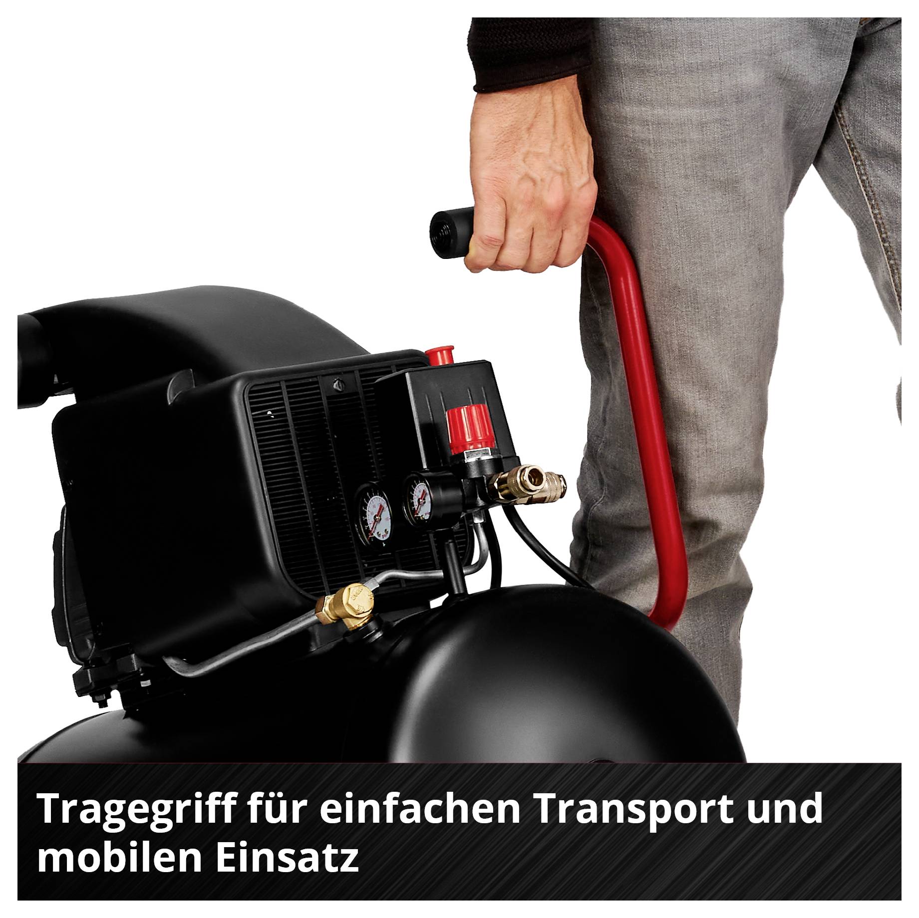 Nahaufnahme einer Hand, die den roten Tragegriff eines schwarzen mobilen Kompressors hält. Text: Tragegriff für einfachen Transport und mobilen Einsatz.
