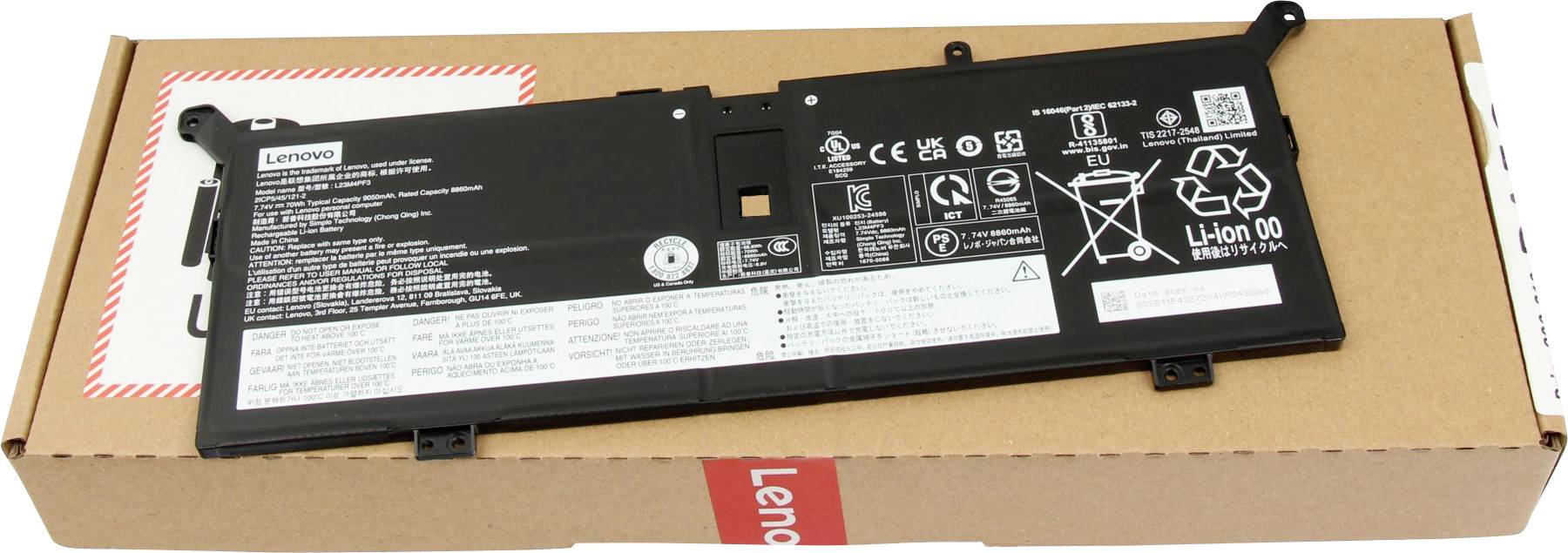 Ein schwarzer Laptop-Akku mit verschiedenen Sicherheitssymbolen und Text, der auf einer braunen Pappschachtel mit der Aufschrift 