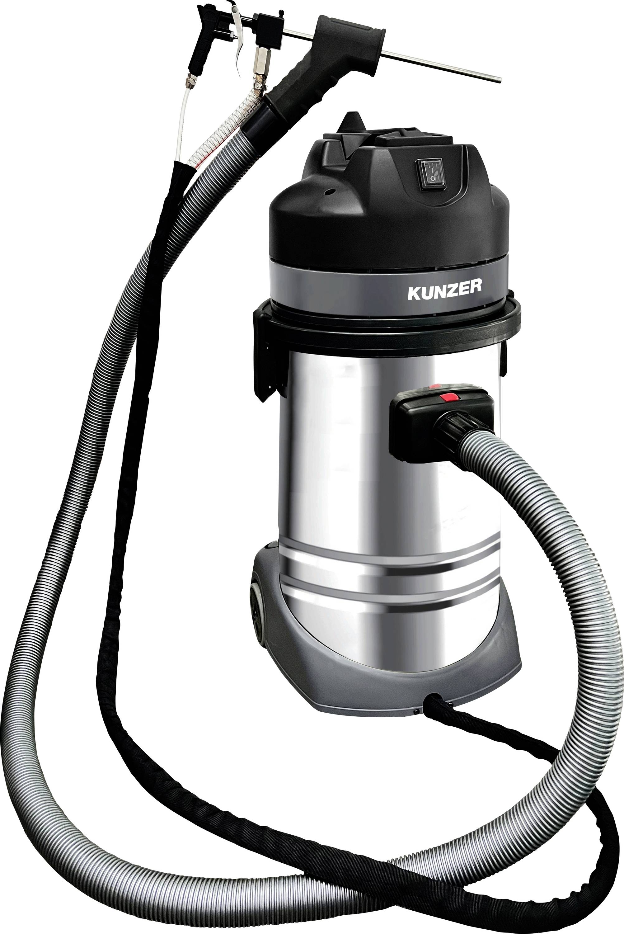Ein Staubsauger mit einem Metallgehäuse und mehreren angeschlossenen Schläuchen, auf dessen Oberseite die Marke 'KUNZER' zu sehen ist.