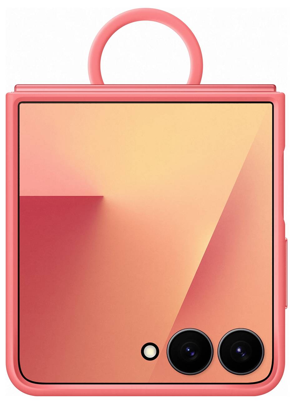 Ein quadratisches korallfarbenes Gerät mit zwei kreisförmigen Kameras und einem ringförmigen Griff oben, das geometrische Muster auf seiner Oberfläche trägt.