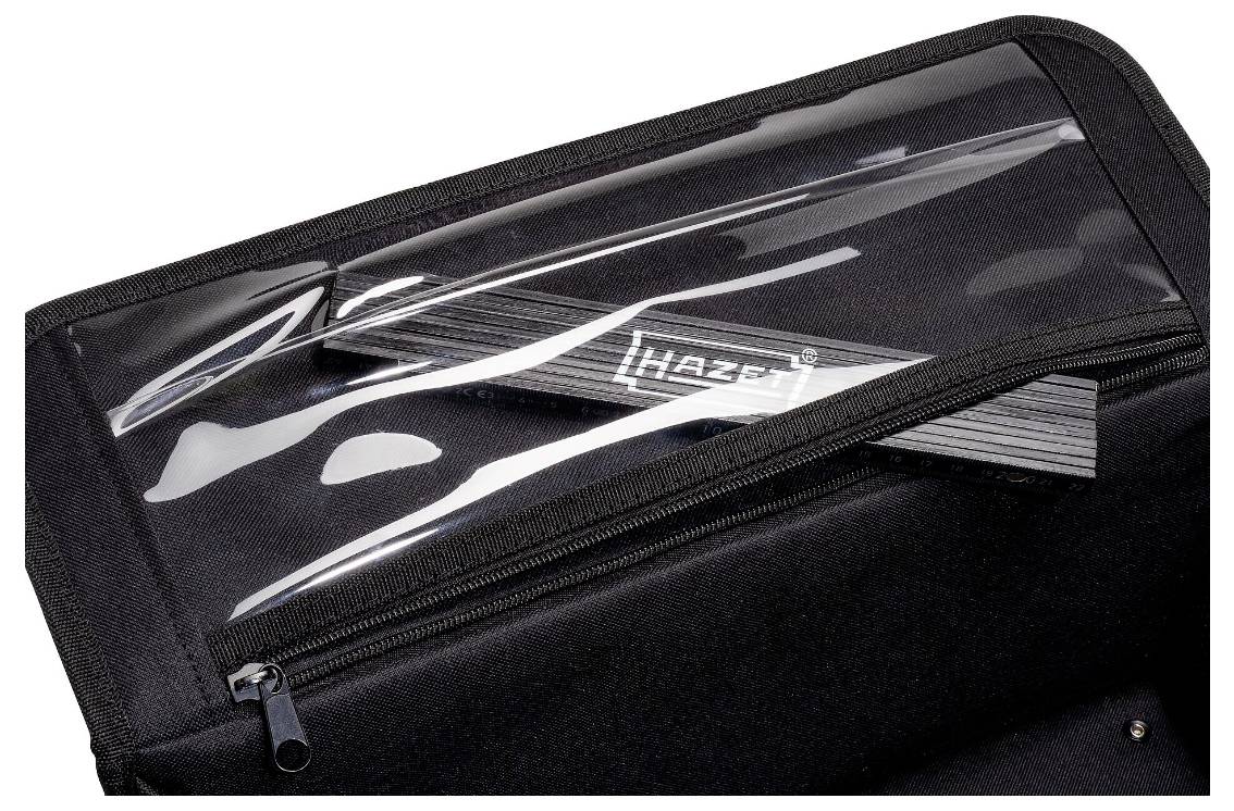 Ein schwarzer Koffer mit transparentem Deckel, in dem eine teilweise sichtbare Hazet-Werkzeugschiene zu erkennen ist. Der Koffer ist leicht geöffnet, mit einem Reißverschluss.