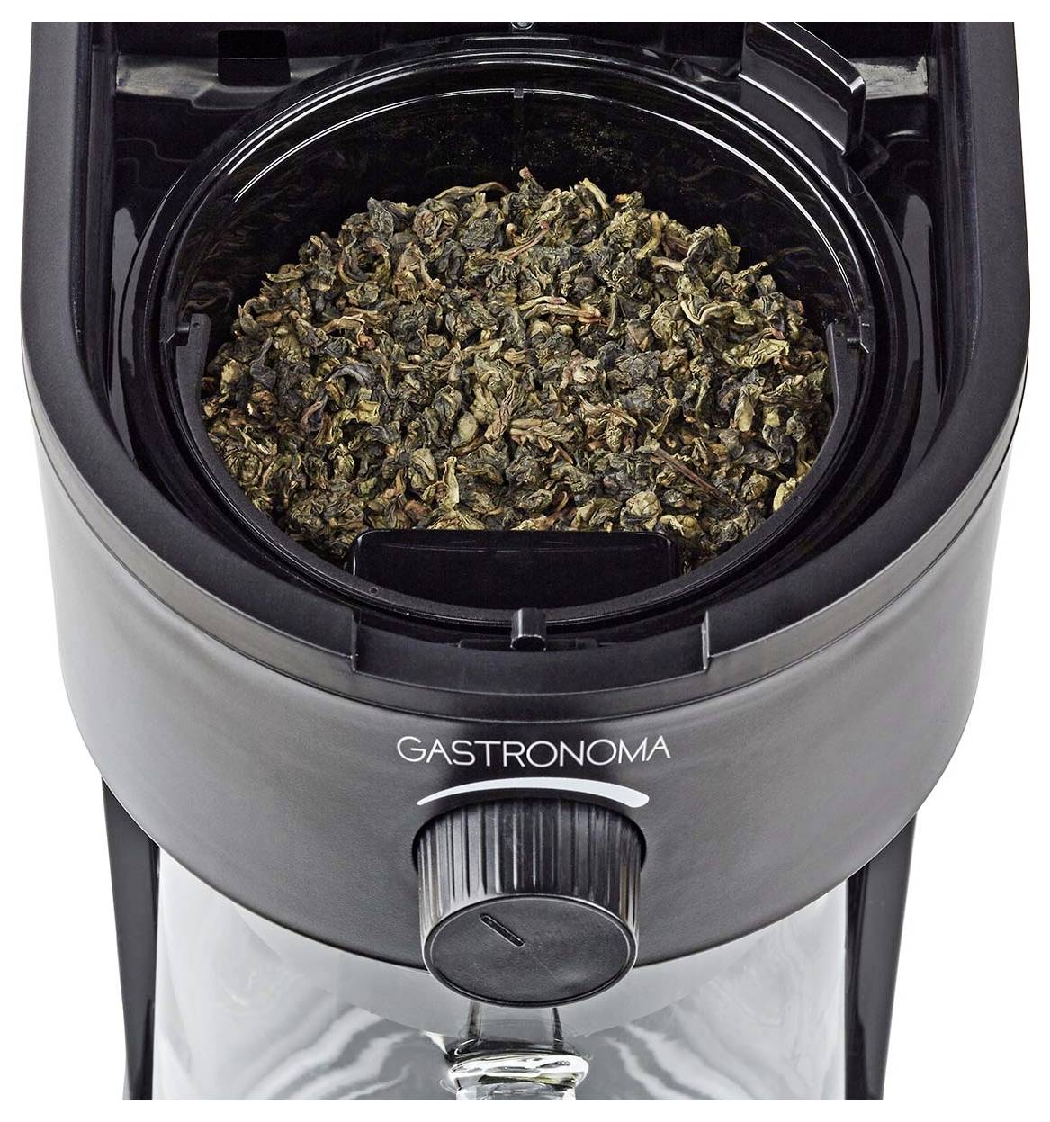 'GASTRONOMA'-Marke Tee- oder Kaffeebohnen in der Kammer einer elektrischen Kaffeemühle, von oben betrachtet, mit Einstellregler an der Vorderseite.