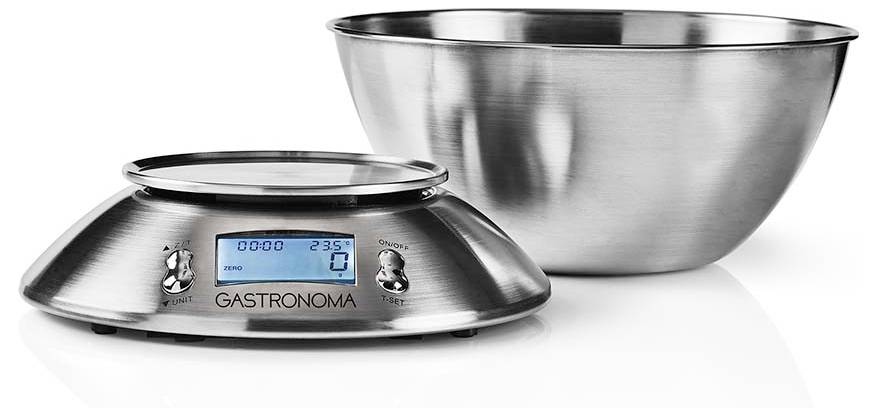 Digitale Küchenwaage aus Edelstahl mit einer Schüssel, die einen blauen LCD-Bildschirm zeigt. Die Waage zeigt 0 Gramm und 23% Akkustand an.